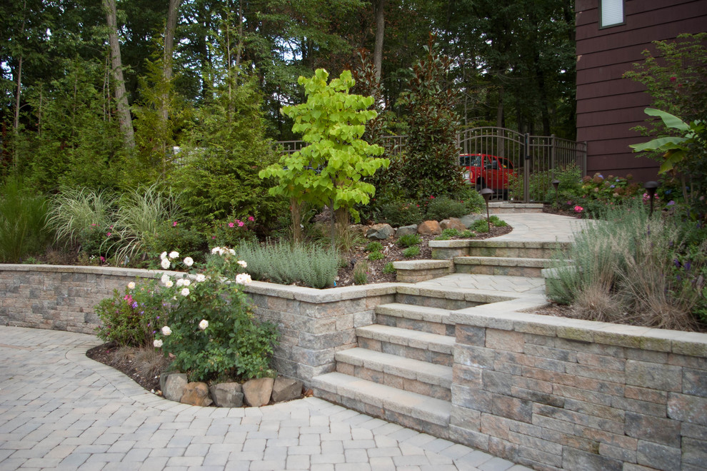 Inspiration for a traditional backyard garden for summer in New York with a garden path and concrete pavers.