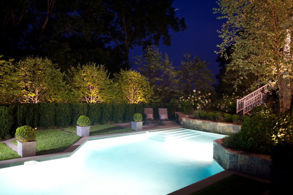 Design ideas for a mid-sized modern full sun backyard stone formal garden in New York for summer.
