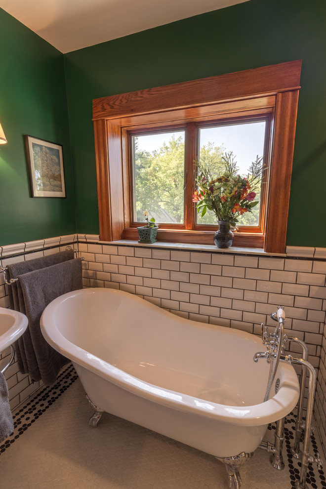 Design ideas for a traditional master bathroom in Minneapolis with a claw-foot tub, a one-piece toilet, white tile, subway tile, green walls, ceramic floors, a pedestal sink, multi-coloured floor and a hinged shower door.