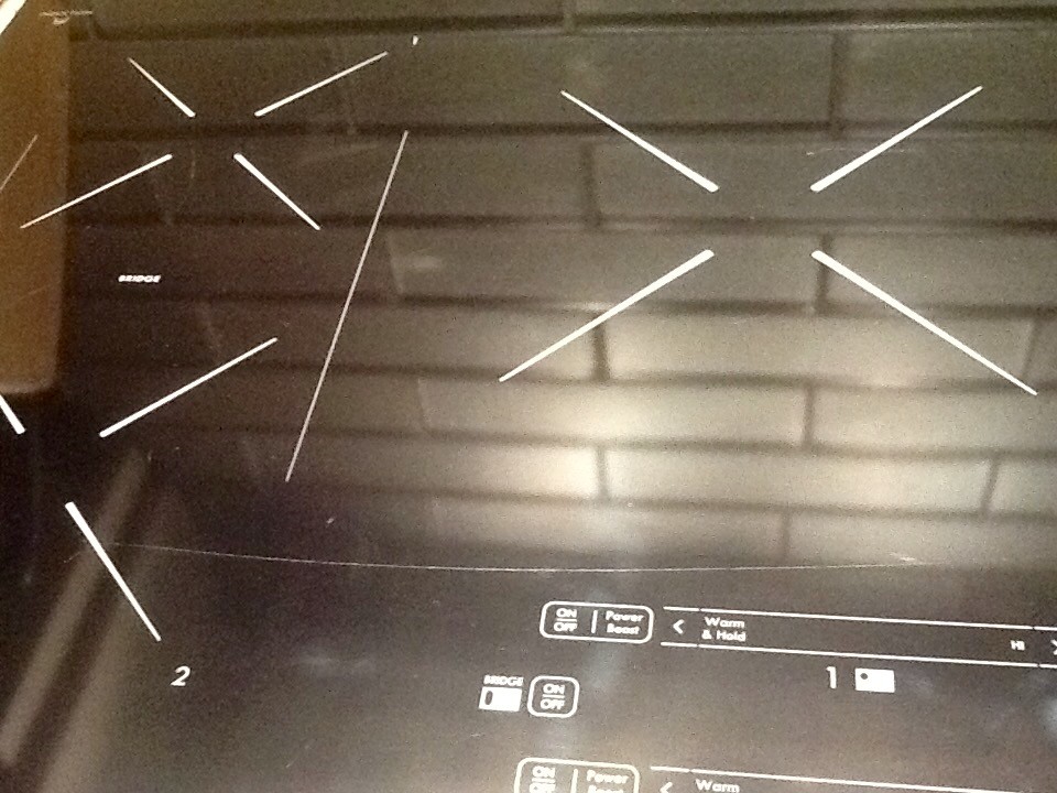 Oh No! Huge scratch in induction cooktop. Help??!!