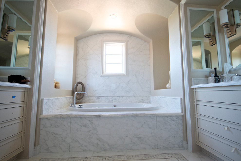 Large contemporary master bathroom in Los Angeles with white tile, stone tile, marble benchtops, a drop-in tub and marble floors.