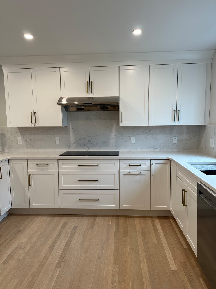Design ideas for a small modern u-shaped eat-in kitchen in Boston with shaker cabinets, white cabinets and a peninsula.