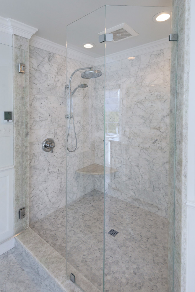 This is an example of a large contemporary master bathroom in Philadelphia with a corner shower, white tile, stone tile, marble floors, quartzite benchtops, raised-panel cabinets, white cabinets, a freestanding tub, grey walls, an undermount sink, grey floor and a hinged shower door.