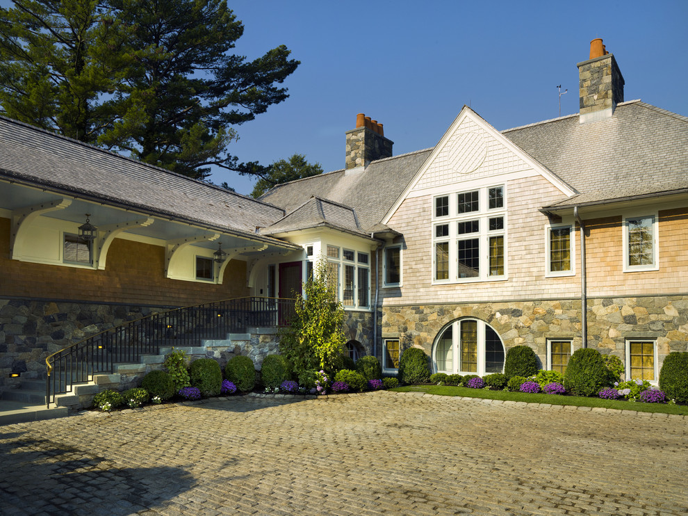 This is an example of a traditional two-storey exterior in New York with wood siding.