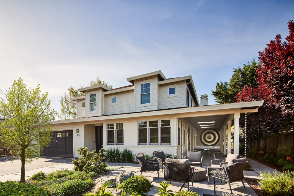 Transitional beige two-story clapboard house exterior idea in San Francisco with a hip roof