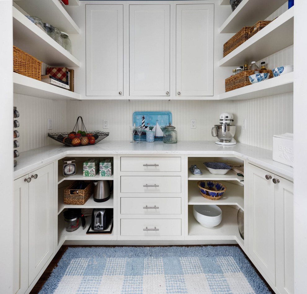 Design ideas for a large traditional kitchen pantry in Seattle with an undermount sink, shaker cabinets, blue cabinets, quartz benchtops, blue splashback, ceramic splashback, stainless steel appliances, porcelain floors, with island, brown floor and white benchtop.