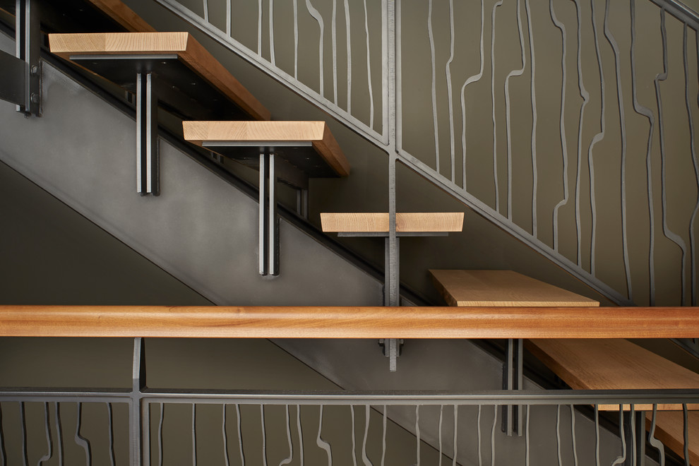 Inspiration for a mid-sized modern wood straight staircase in Seattle with open risers.