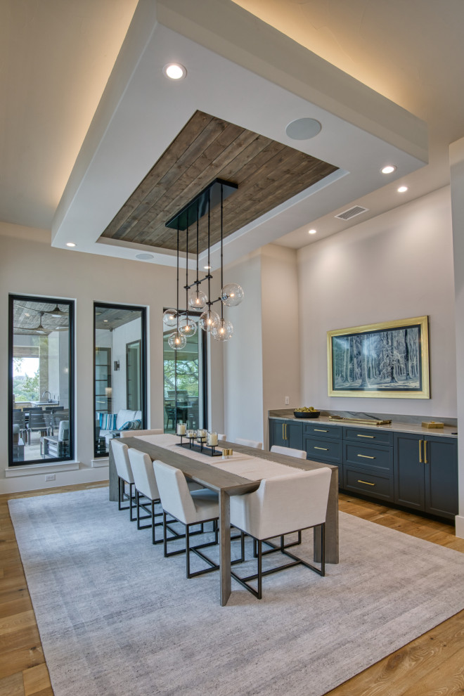 Example of a transitional dining room design in Austin