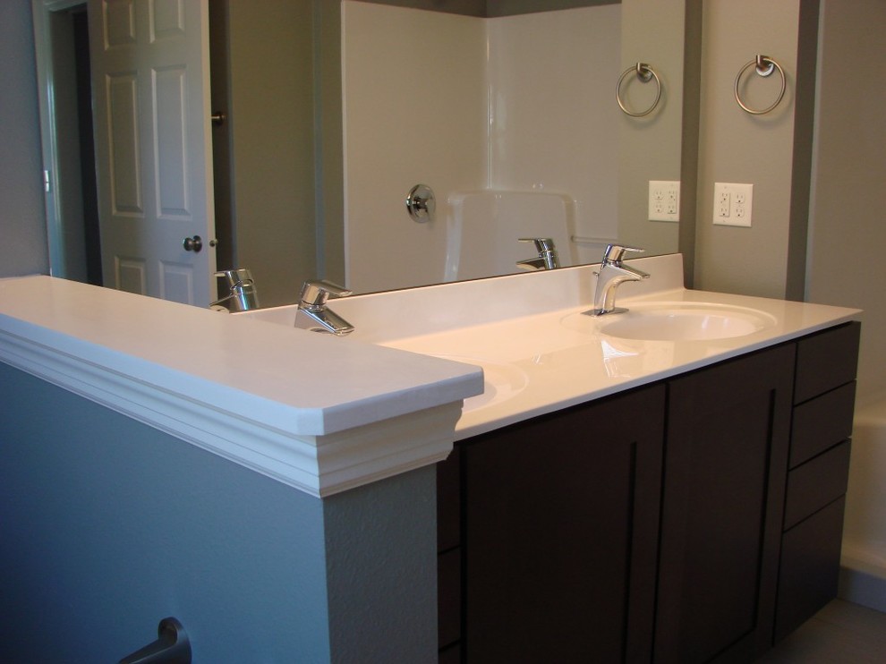 Example of a mid-sized transitional master gray tile and ceramic tile ceramic tile bathroom design with shaker cabinets, dark wood cabinets and marble countertops