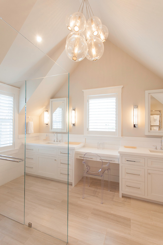 Photo of a large beach style master bathroom in Boston with an undermount sink, shaker cabinets, white cabinets, a curbless shower, beige walls and light hardwood floors.