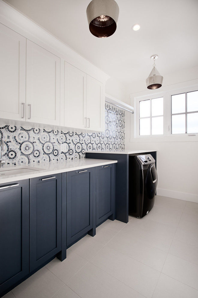 Design ideas for a transitional laundry room in Calgary.