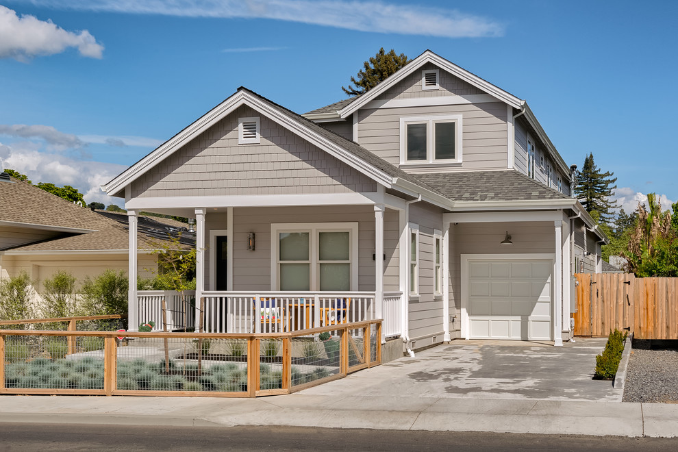 Country two-storey grey house exterior in San Francisco with concrete fiberboard siding, a gable roof and a shingle roof.