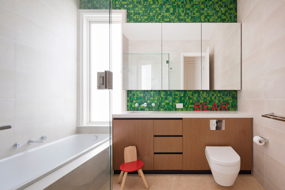 Design ideas for a contemporary kids bathroom in Melbourne with a wall-mount toilet, green tile and mosaic tile.