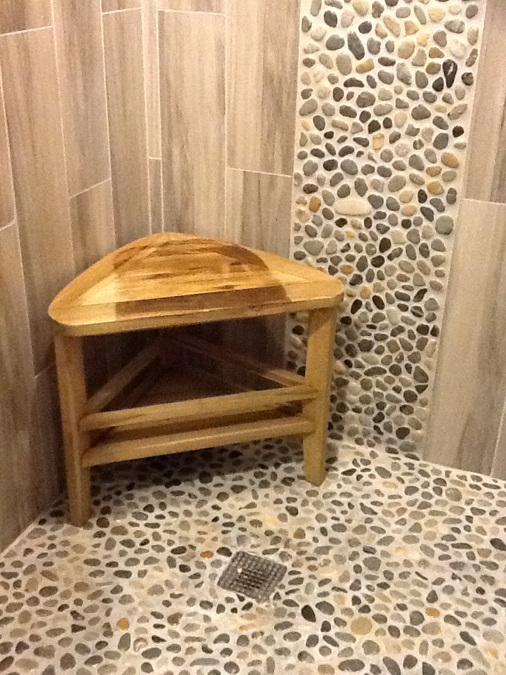 Inspiration for a coastal multicolored tile corner shower remodel