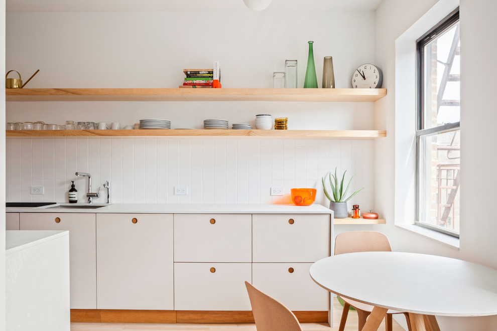 This is an example of a scandinavian kitchen in New York.