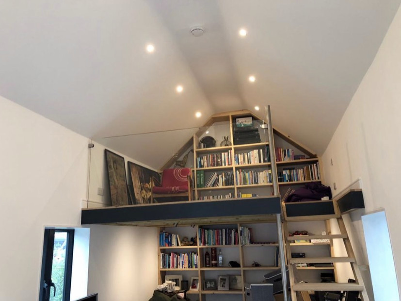 Photo of a large scandinavian home office in Oxfordshire with a reading nook.