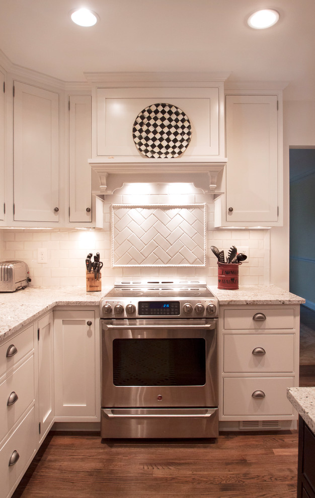 Example of a transitional u-shaped eat-in kitchen design in DC Metro with beaded inset cabinets, white cabinets, granite countertops, white backsplash, subway tile backsplash and stainless steel appliances