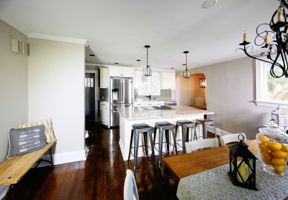 Eat-in kitchen - large transitional dark wood floor eat-in kitchen idea in Baltimore with an undermount sink, raised-panel cabinets, white cabinets, granite countertops, green backsplash, glass tile backsplash, stainless steel appliances and an island