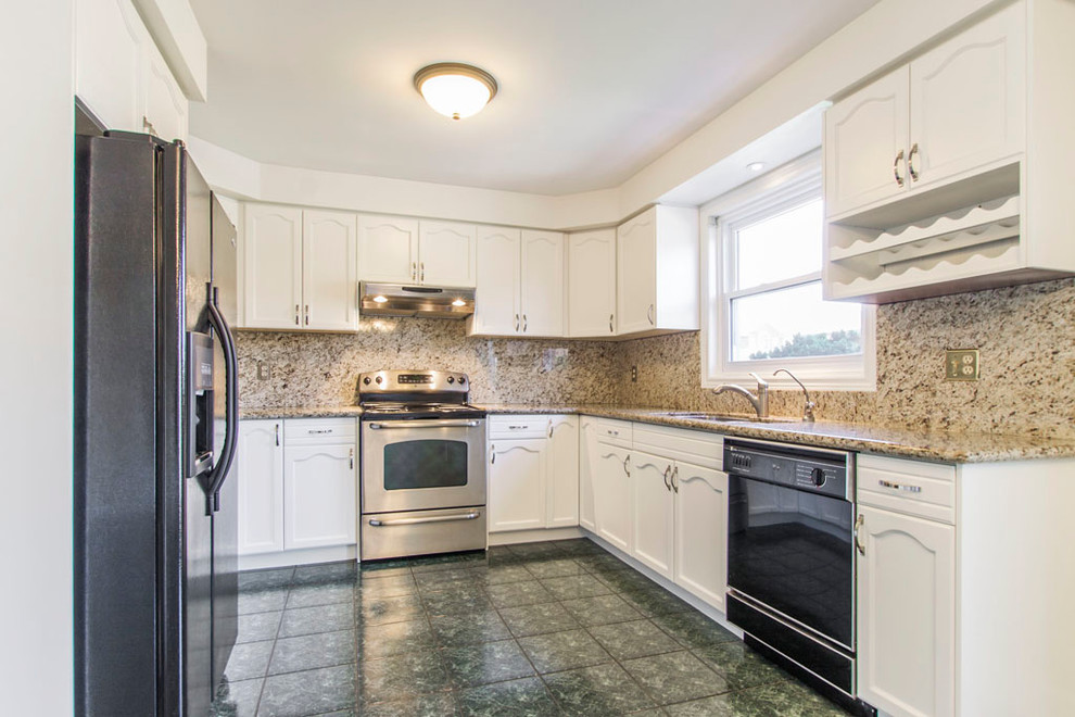 Example of a transitional kitchen design in Toronto