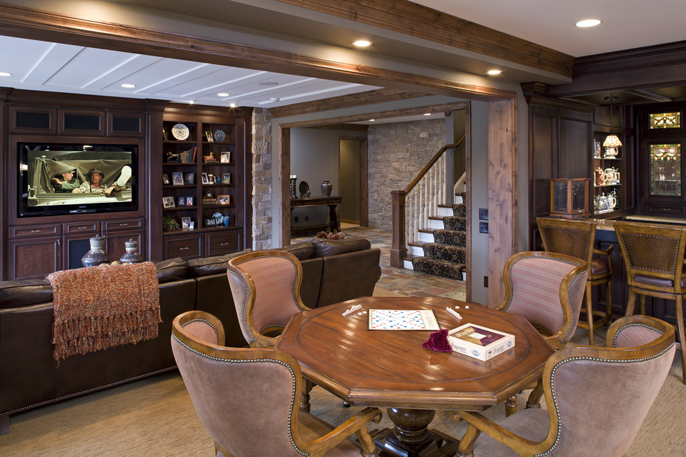 Inspiration for a large traditional open concept family room in Minneapolis with brown walls, carpet, a built-in media wall, a game room and a standard fireplace.