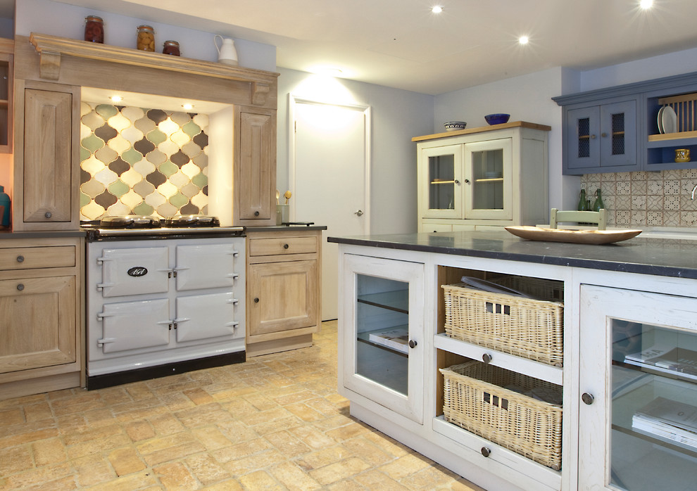 Design ideas for a large traditional open plan kitchen with white cabinets and with island.