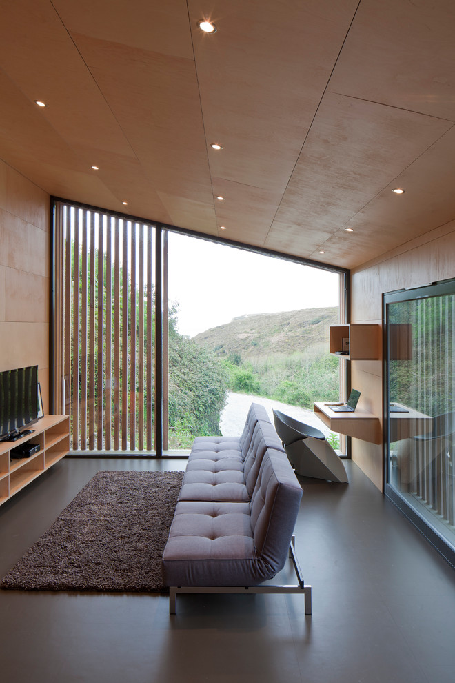 This is an example of a mid-sized contemporary formal open concept living room in Barcelona with brown walls, no fireplace and a built-in media wall.