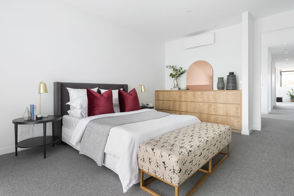 Design ideas for a contemporary master bedroom in Melbourne with white walls, carpet and grey floor.