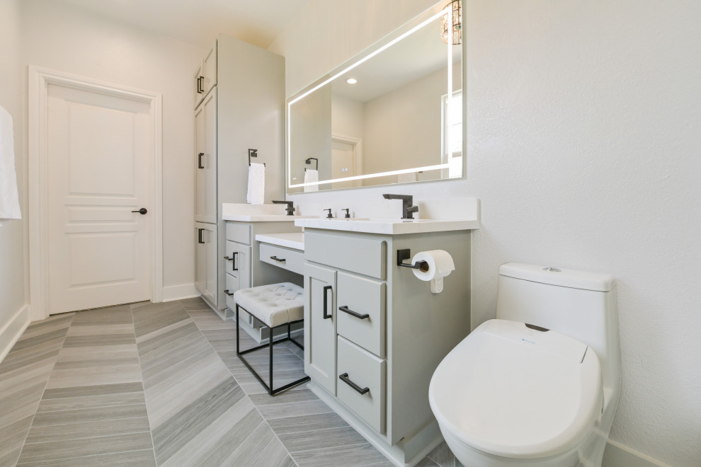 Small modern 3/4 bathroom in San Francisco with flat-panel cabinets, grey cabinets, a floating vanity, a double vanity, marble benchtops, white benchtops, a curbless shower, a one-piece toilet, grey walls, ceramic floors, grey floor and a hinged shower door.