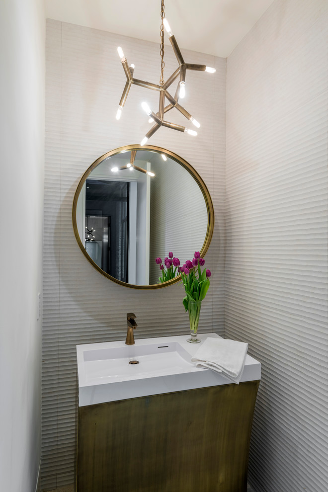 Design ideas for a mid-sized contemporary powder room in Dallas with white tile, flat-panel cabinets, a one-piece toilet, white walls, an integrated sink, engineered quartz benchtops and white benchtops.