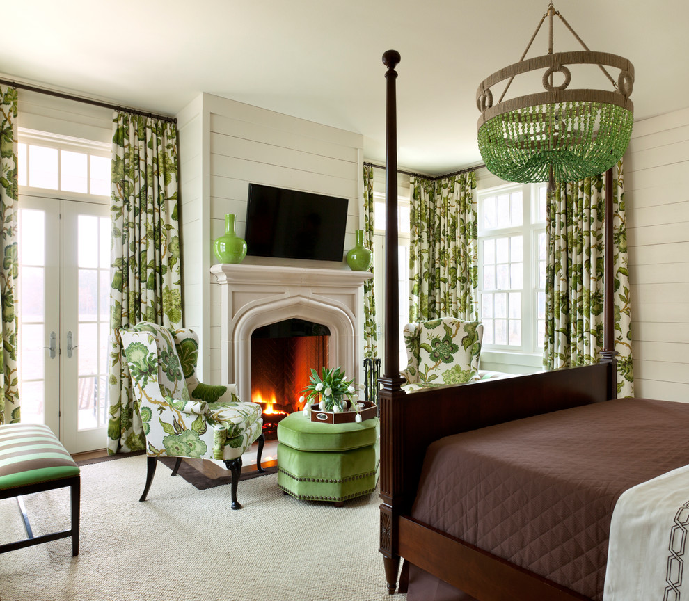 Inspiration for a large traditional master bedroom in Little Rock with white walls, dark hardwood floors, a standard fireplace and a stone fireplace surround.