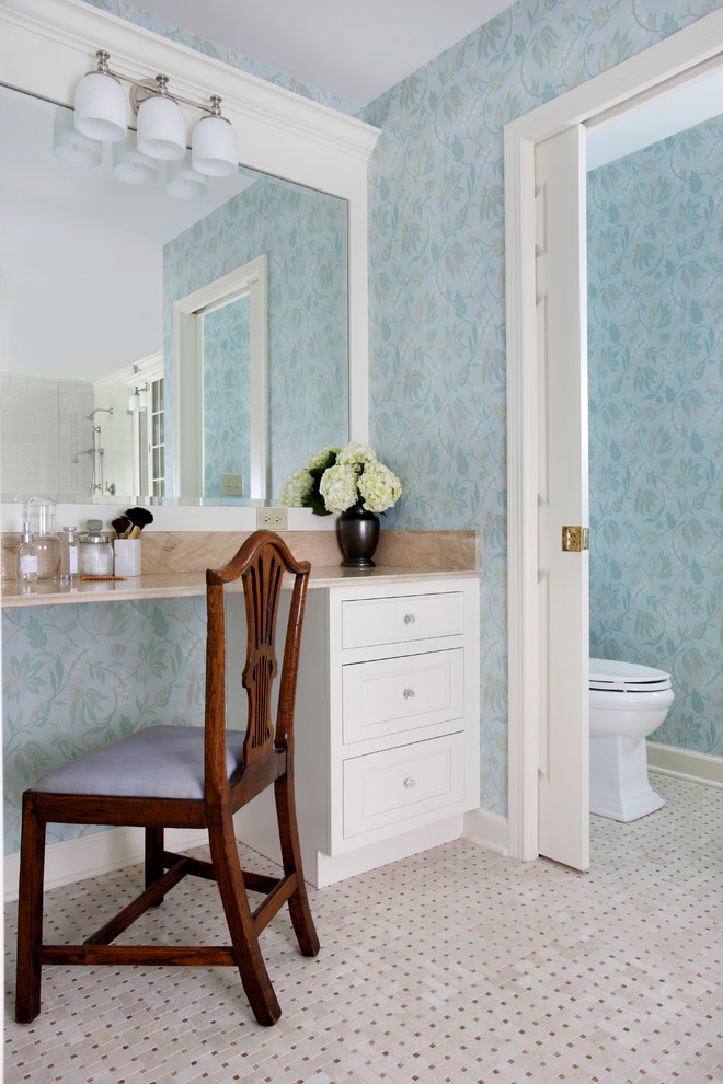 Photo of a mid-sized traditional master bathroom in Chicago with marble benchtops, recessed-panel cabinets, white cabinets, beige tile and blue walls.