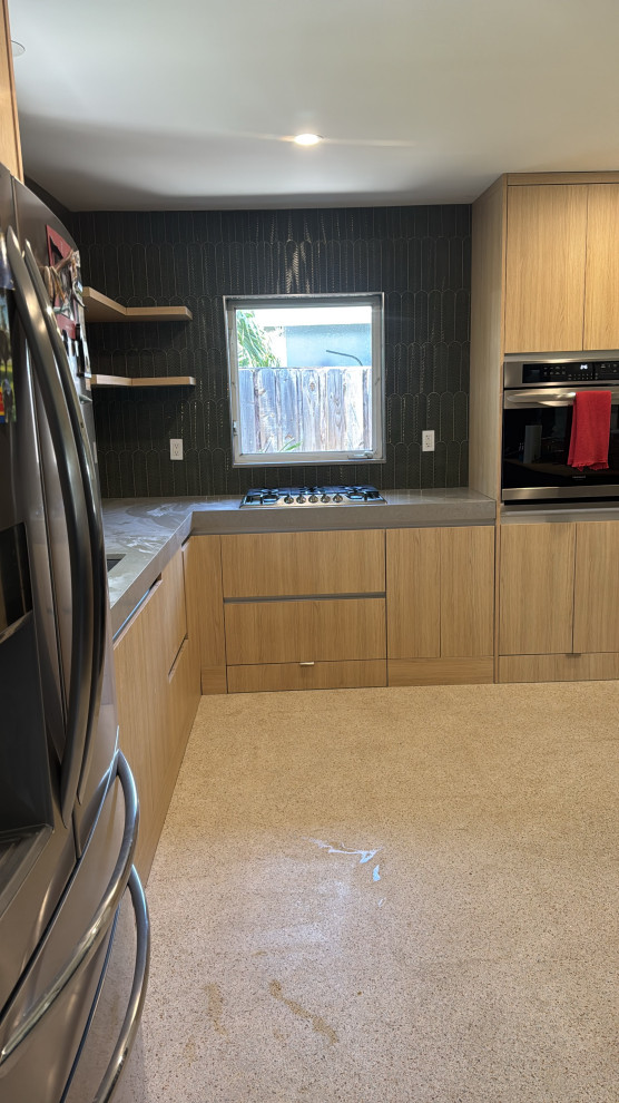 Mid-sized minimalist kitchen photo in Miami with green backsplash and ceramic backsplash