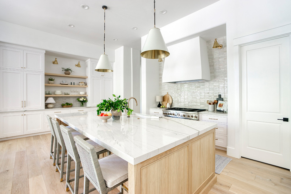 Inspiration for a transitional kitchen remodel in Phoenix with beaded inset cabinets, light wood cabinets, quartzite countertops, white backsplash and stone tile backsplash