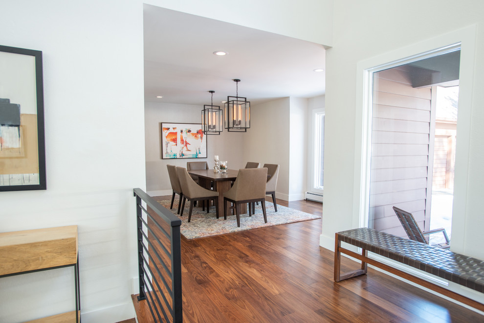 Mid-sized contemporary separate dining room in Denver with beige walls, medium hardwood floors and no fireplace.