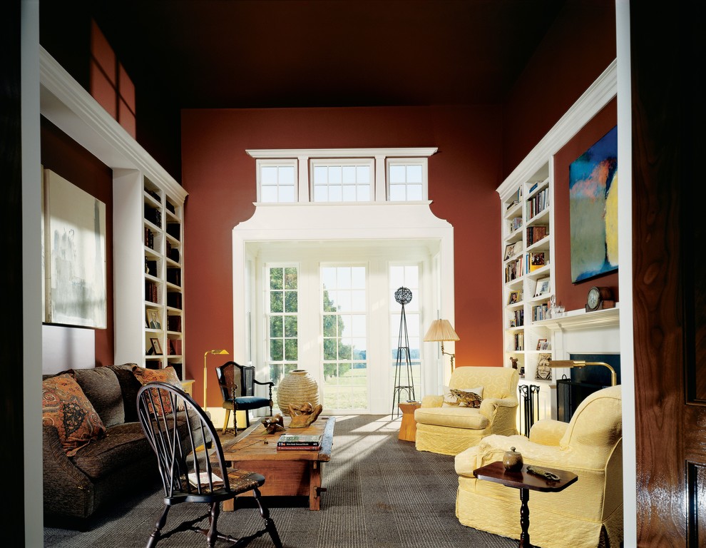 Living room library - farmhouse living room library idea in Richmond with red walls