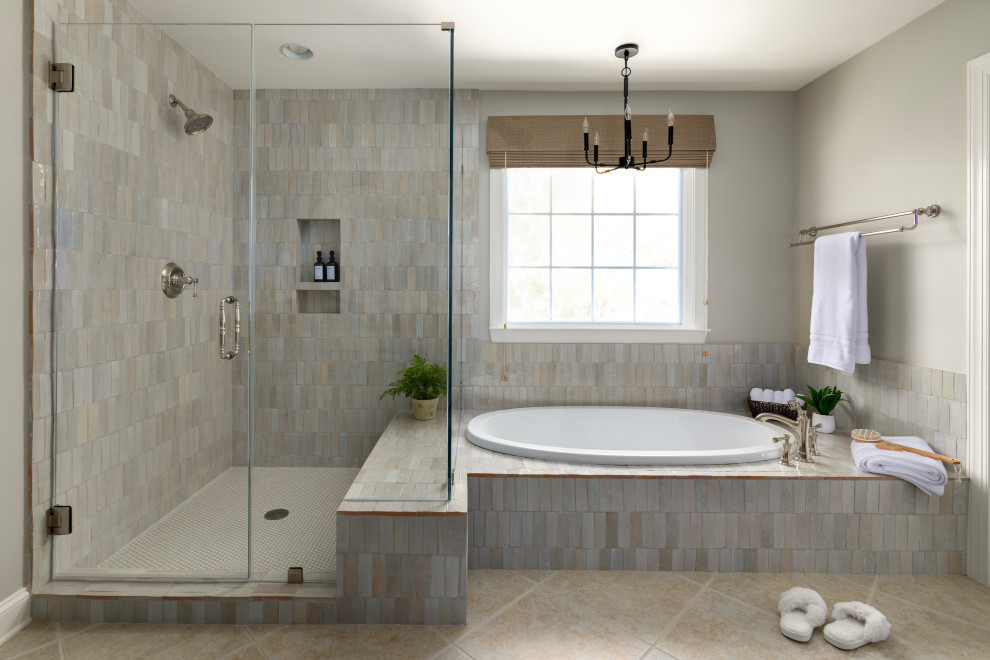 Inspiration for a traditional bathroom in Other with a built-in bath, a corner shower, grey tiles, beige walls, beige floors, a hinged door, a wall niche and a shower bench.