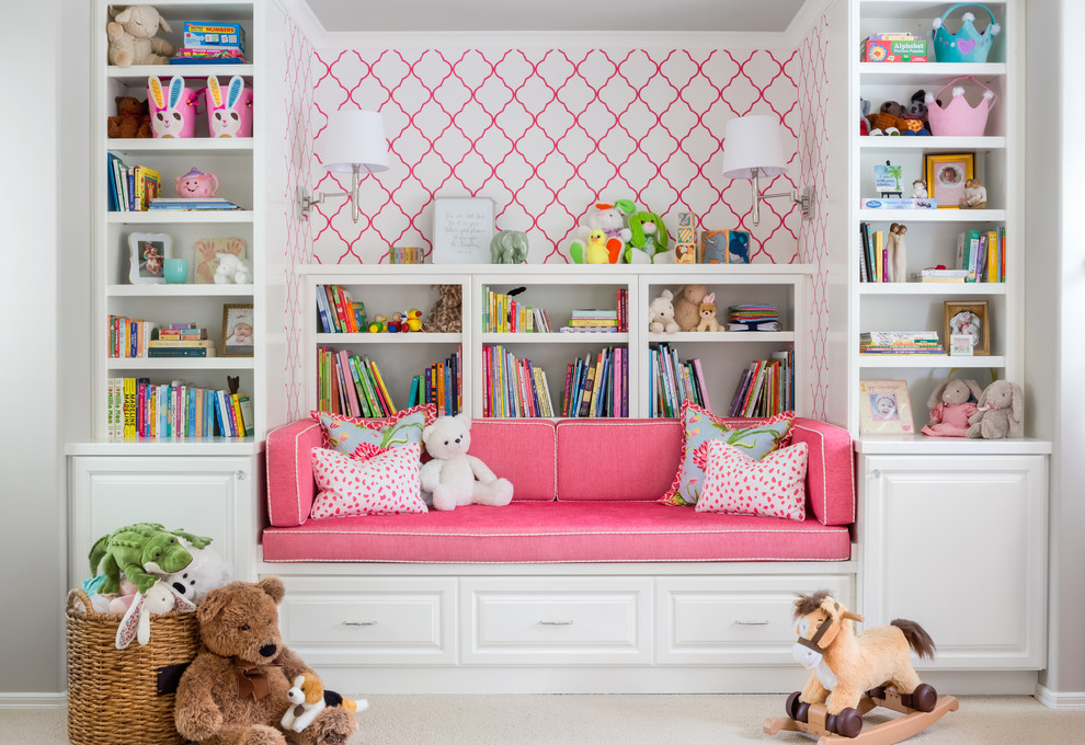 This is an example of a traditional kids' room for girls in Seattle with carpet and beige floor.