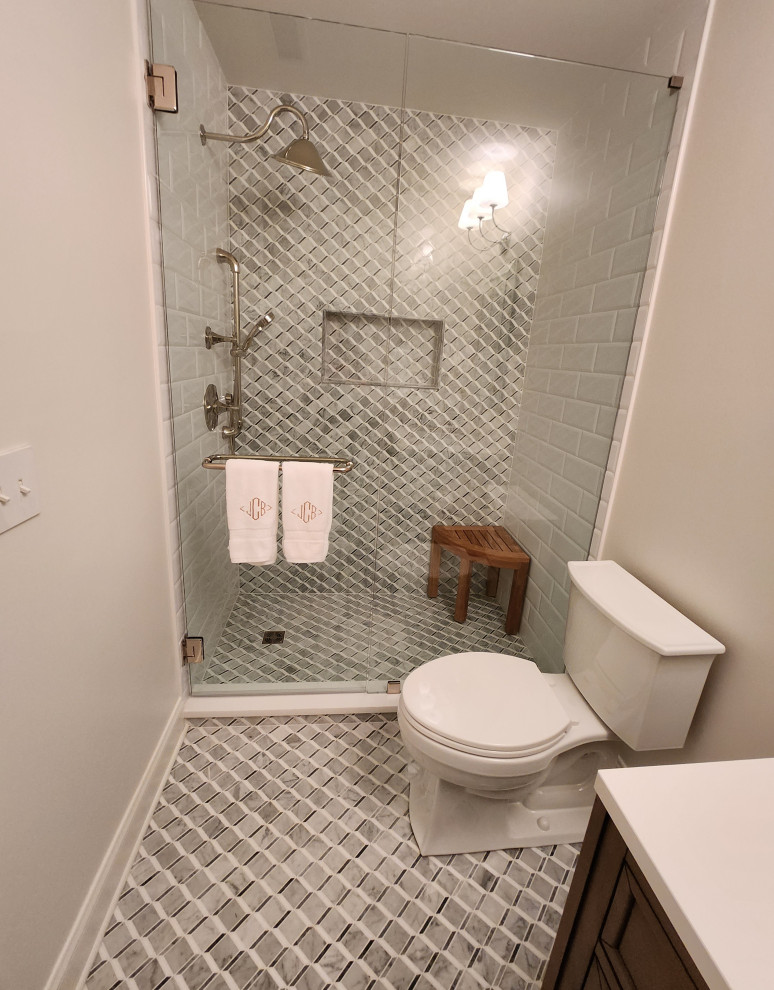 Inspiration for a mid-sized transitional bathroom in Nashville with gray tile, white walls, marble floors, grey floor and a hinged shower door.