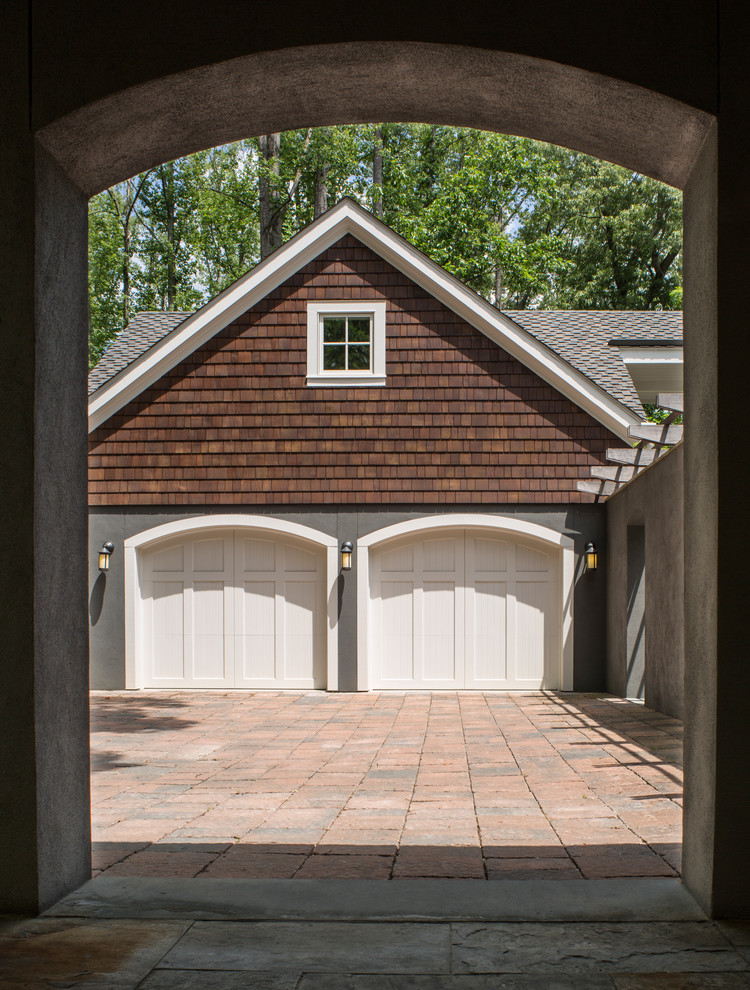 Photo of a traditional detached two-car garage in Other.