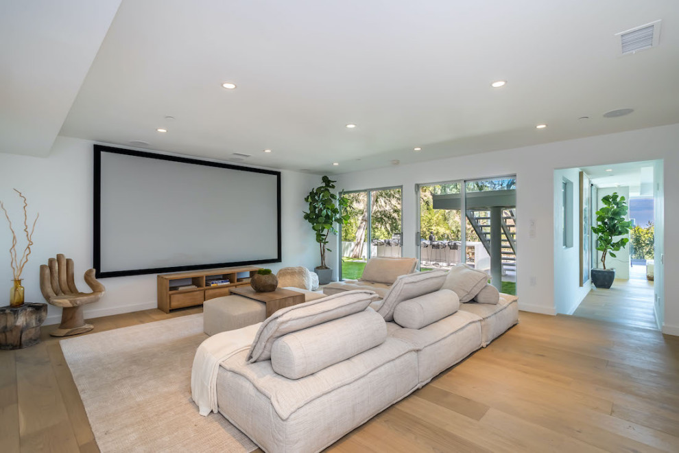Photo of a contemporary home theatre in Los Angeles.