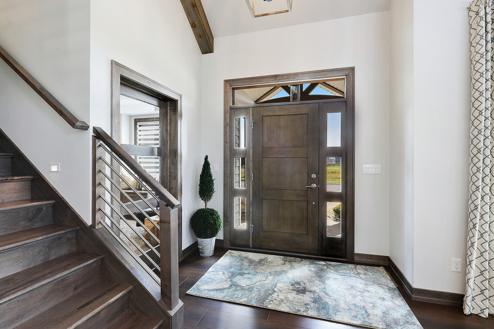 Inspiration for a mid-sized transitional vinyl floor and brown floor front door remodel with white walls and a dark wood front door