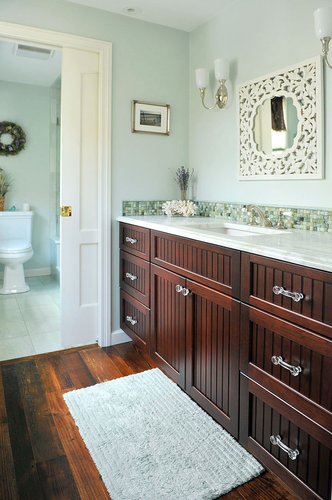 Inspiration for an eclectic bathroom in Providence with an undermount sink, beaded inset cabinets, dark wood cabinets, marble benchtops, an alcove shower, a one-piece toilet and green tile.