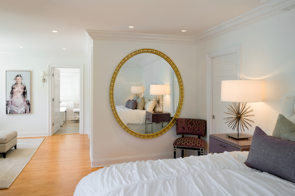 This is an example of a mid-sized eclectic master bedroom in Philadelphia with white walls, medium hardwood floors and no fireplace.