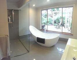 Photo of a contemporary bathroom in Adelaide with an open shower.