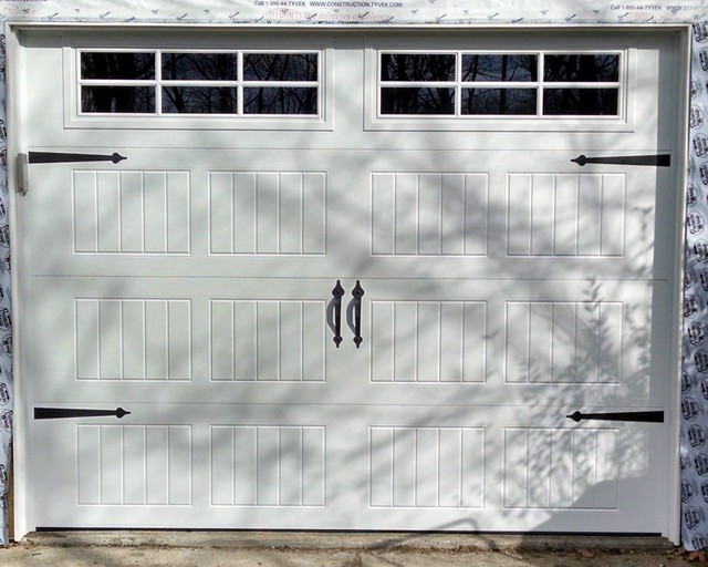 White Overhead Garage Door With Rectangular Windows traditional-car-porch