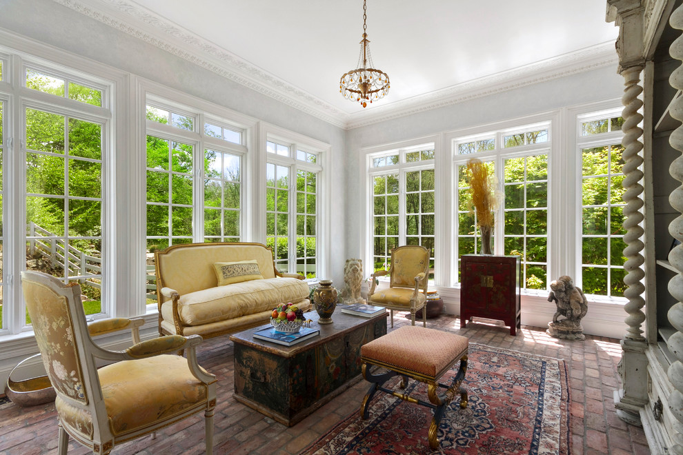 Inspiration for a large traditional sunroom in New York with brick floors, a standard ceiling, no fireplace and red floor.