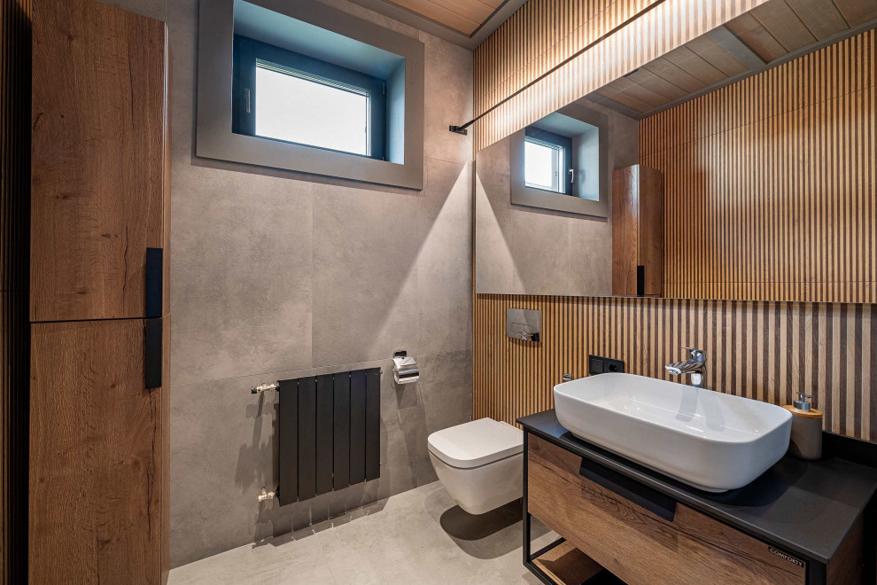 Photo of a large contemporary bathroom in Moscow with an alcove shower, grey tiles, marble tiles, mosaic tile flooring, grey floors, a sliding door, white worktops, a single sink and a vaulted ceiling.