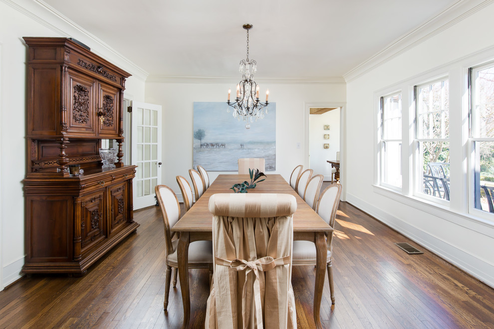 Large french country medium tone wood floor and brown floor enclosed dining room photo in Birmingham with white walls and no fireplace