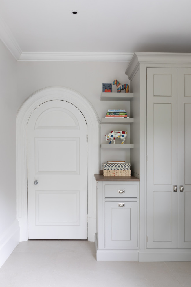 Example of a transitional home office design in London