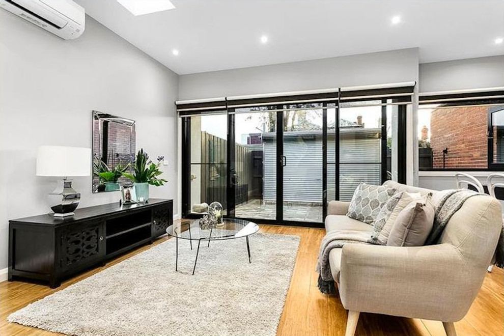 Design ideas for a contemporary living room in Melbourne.